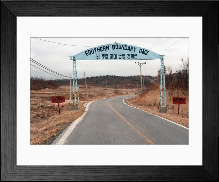 Framed Print : Road sign near the southern boundary of the De-Militarized Zone between North and South Korea. Mar. 28 1984. (BSLOC_2011_12_195) Framed Print : Road sign near the southern boundary of the De-Militarized Zone between North and South Korea. Mar. 28 1984. (BSLOC_2011_12_195)