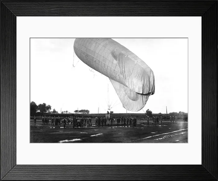 Framed Print : U.S. Observation balloon with three men in its basket, ascending from Camp de Meucon, France. World War I. Ca. 1918