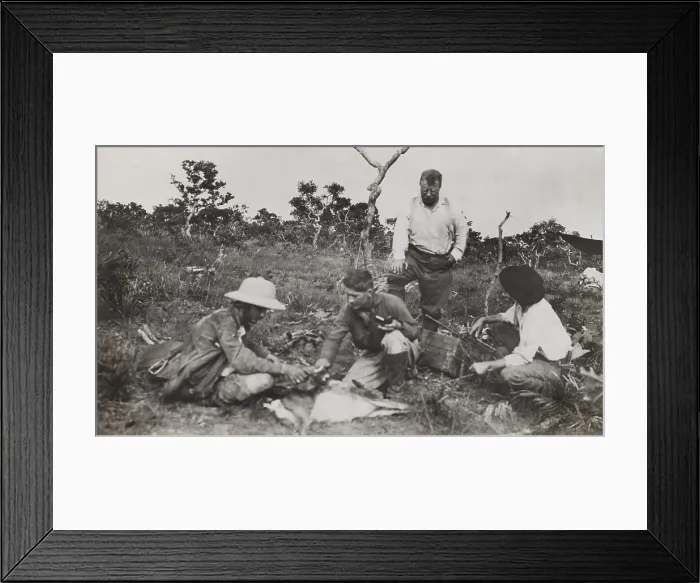 Framed Print : Naturalists of the Smithsonian-Roosevelt African Expedition, squatting around a dead animal. L-R: Kermit Roosevelt, Edmund Heller, Theodore Roosevelt (standing), unidentified