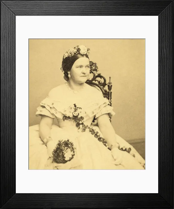 Framed Print : Mary Todd Lincoln as First Lady, holding flowers, 1861. Carte de visite by Mathew Brady (BSLOC_2016_14_41) Framed Print : Mary Todd Lincoln as First Lady, holding flowers, 1861. Carte de visite by Mathew Brady (BSLOC_2016_14_41)
