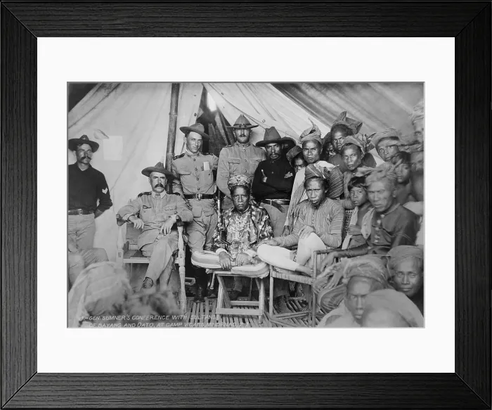 Framed Print : Gen. Samuel Sumners conference with Sultans of Bayang and Oato, at Camp Vicars, Mindanao, P.I. 1902. Capt. John Pershing, in his campaign hat, stands in center behind one Sultan
