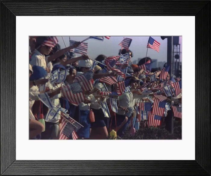 Framed Print : Israeli children waving American flags line the route of the Presidential motorcade. Richard Nixon was the first US President to visit Israel. June 16 1974