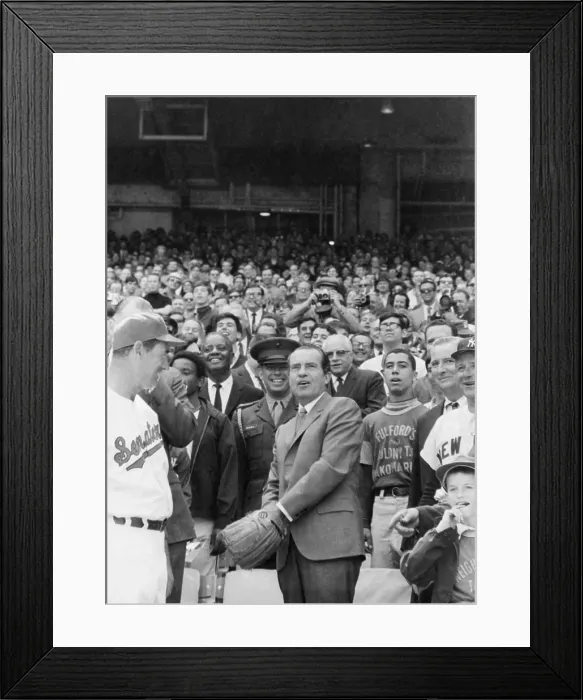 Framed Print : Pres. Richard Nixon tossing First Pitch at Senators opening game with New York Yankees. Manager Ted Williams is at left; Senators owner Bob Short at right