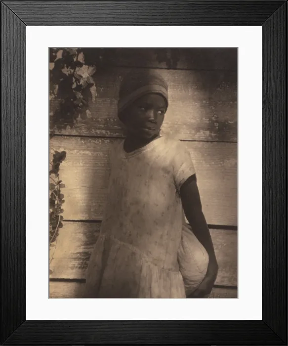 Framed Print : Young African American girl holding bag in sensitive portrait by Doris Ullman, ca. 1930. Ulmann graduated from the Clarence H. White School of Modern Photography