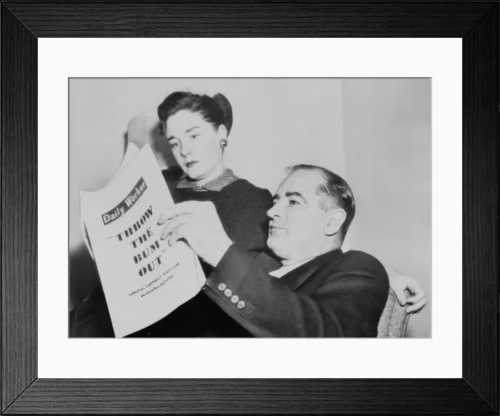 Framed Print : Sen. and Mrs. Joseph R. McCarthy at home as the Senate prepared to his censure. Nov. 8, 1954. They are reviewing Photostats of the Communist Daily Worker urging the U.S