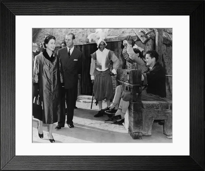 Framed Print : Queen Elizabeth II and Prince Philip are amused by two prisoners in stocks at Jamestown Framed Print : Queen Elizabeth II and Prince Philip are amused by two prisoners in stocks at Jamestown