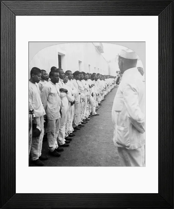 Framed Print : 500 prisoners in formation against a wall, under guard, at the San Juan, Puerto Rico Jail in 1900, shortly after the U.S