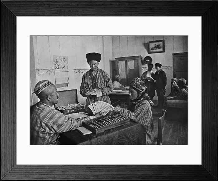 Framed Print : Turkmenian collective farmers receiving their share of yearly profits in the 1930s. The farm administrator calculates with an Abacus Framed Print : Turkmenian collective farmers receiving their share of yearly profits in the 1930s. The farm administrator calculates with an Abacus