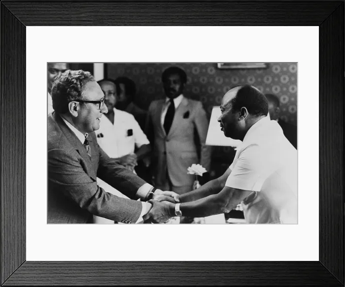 Framed Print : Liberian President William Tolbert Jr. and Henry Kissinger clasp hands. ?May 1, 1976. Kissinger was on a 7 nation tour of African from April 24-May 5, 1976. (BSLOC_2015_14_51)