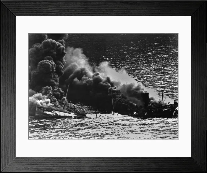 Framed Print : Allied tanker torpedoed in Atlantic Ocean by German submarine during World War 2. The ship crumbled amidships under heat of fire as she settled toward bottom of sea. 1942 Framed Print : Allied tanker torpedoed in Atlantic Ocean by German submarine during World War 2. The ship crumbled amidships under heat of fire as she settled toward bottom of sea. 1942