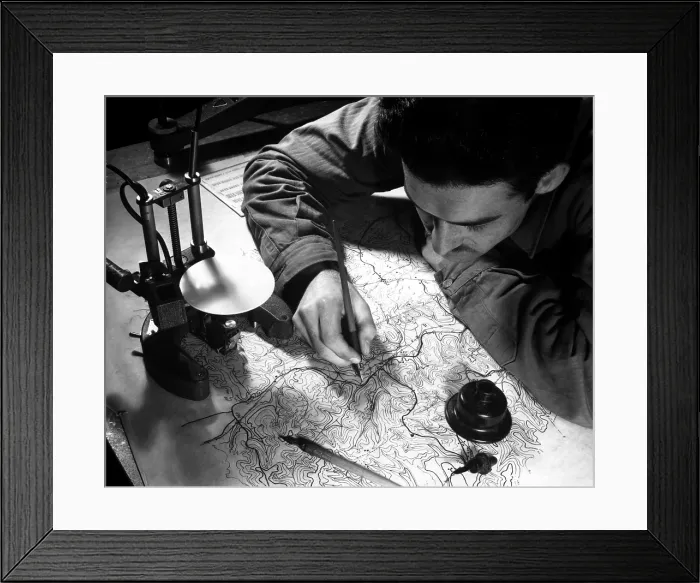 Framed Print : World War 2 Strategic planning for the invasion of Europe. U.S. Army map maker inking in the pencil tracings of culture, hydrography, and land contours. England, Jan. 11, 1943