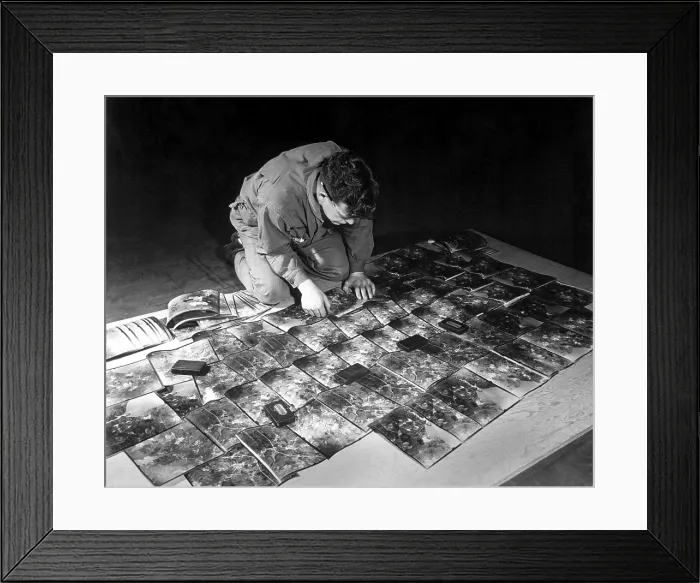 Framed Print : World War 2 Strategic planning for the invasion of Europe. U.S. Army engineer laying out the aerial photographs. Kew Gardens, England, Jan. 11, 1943. (BSLOC_2013_11_103)