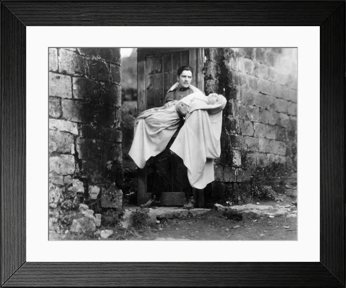 Framed Print : THE WHITE SISTER, Ronald Colman, carrying Lillian Gish, 1923