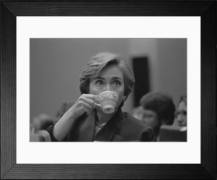 Framed Print : First Lady Hillary Rodham Clinton, during her presentation on health care to Congress. She sips from a teacup, Sept. 1993 (BSLOC_2016_12_1) Framed Print : First Lady Hillary Rodham Clinton, during her presentation on health care to Congress. She sips from a teacup, Sept. 1993 (BSLOC_2016_12_1)