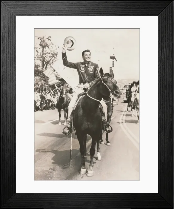Framed Print : Ronald Reagan, newly elected Governor of California, riding a horse in a parade. Dec. 1966. (BSLOC_2015_14_74)