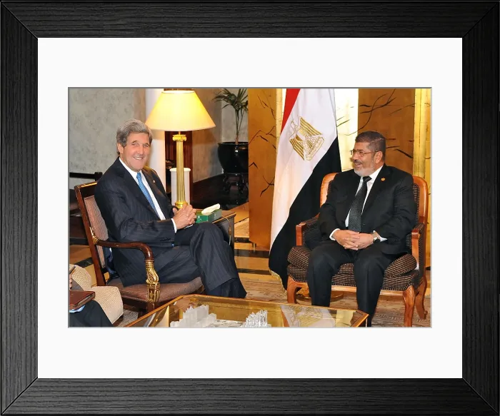 Framed Print : U.S. Secretary of State John Kerry meets with Egyptian President Mohamed Morsi. May 25, 2013. They were attending the 50th Anniversary African Union Summit in Addis Ababa