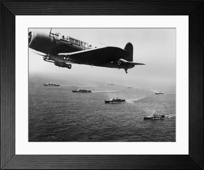 Framed Print : American military convoy in the South Atlantic Ocean. A U.S. Vindicator Scout bomber flies anti-submarine patrol over the convoy. Nov