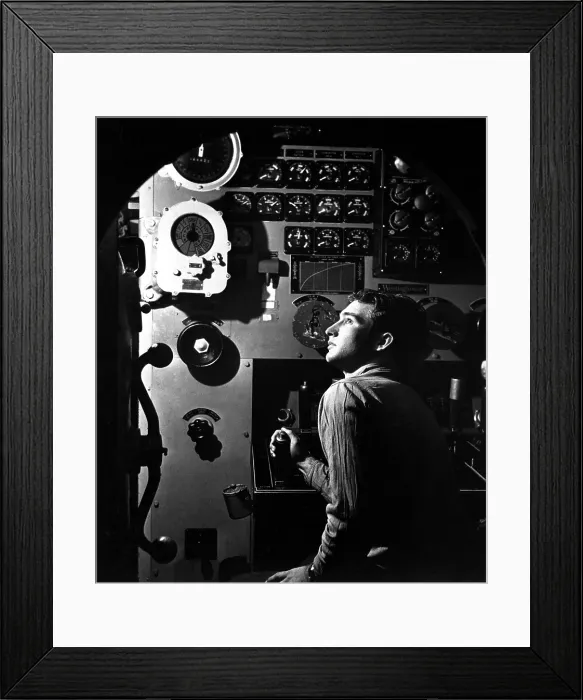 Framed Print : Sailor at work in the electric engine control room of USS BATFISH on submarine war patrol, World War 2, May 1945. (BSLOC_2013_11_118)