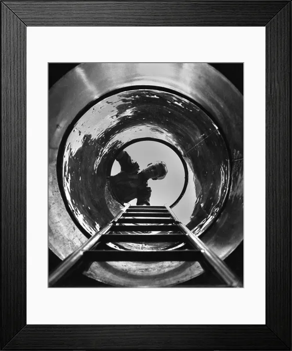 Framed Print : U.S. sailor looks down the hatch the submarine, USS MARLIN at New London, Conn. World War 2, August 1943. (BSLOC_2013_11_120)
