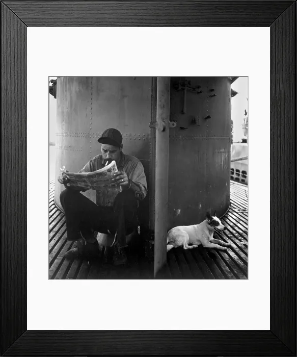 Framed Print : U.S. submariner reading his favorite comic-strip. The submarine mascot rests in the shade of the conning tower. During World War 2, ca. 1942-45. (BSLOC_2013_11_121) Framed Print : U.S. submariner reading his favorite comic-strip. The submarine mascot rests in the shade of the conning tower. During World War 2, ca. 1942-45. (BSLOC_2013_11_121)