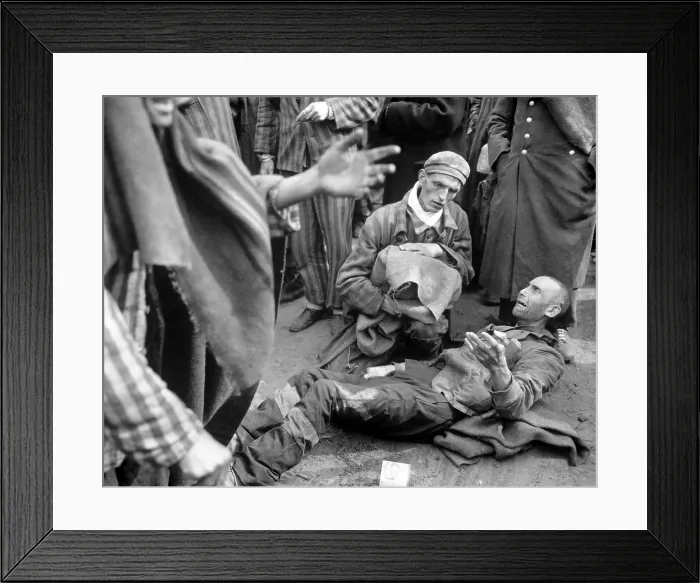 Framed Print : Inmates of Wobbelin concentration camp awaiting transport to the hospital. One breaks into tears when he learns he is not leaving with the first group