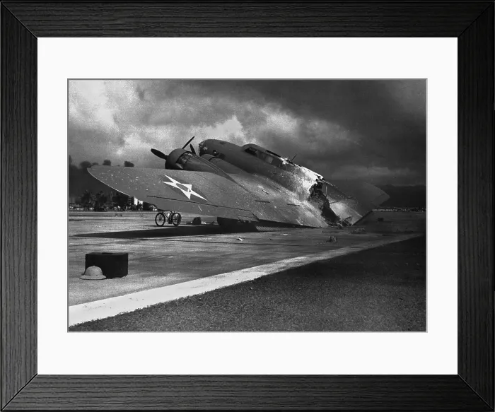 Framed Print : Ruins of a B-17C aircraft rests near at Hickam Field after the Japanese attack on Pearl Harbor, Dec. 7, 1941. Nearly half of the approx