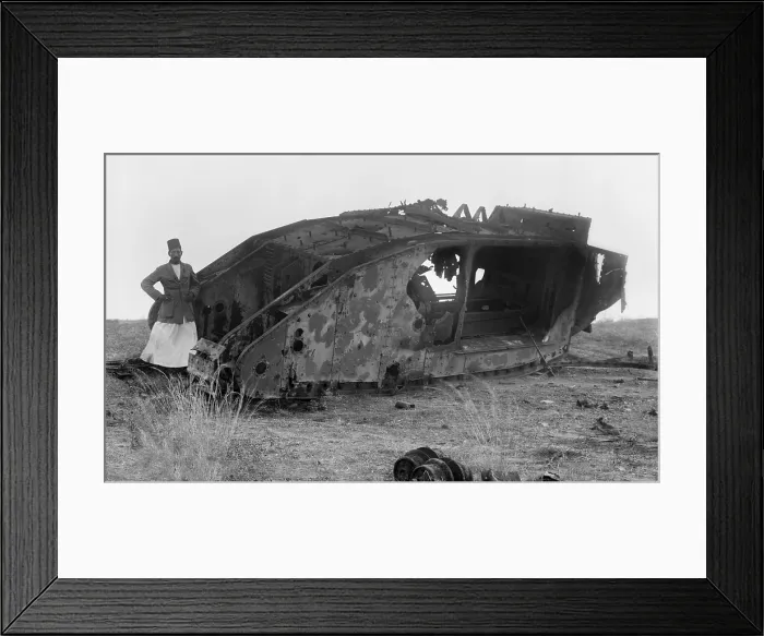 Framed Print : World War 1 in the Middle East. Palestinian man stands near a disabled British tank at Gaza, the site of three critical battles between Ottoman and British Empire forces in 1917