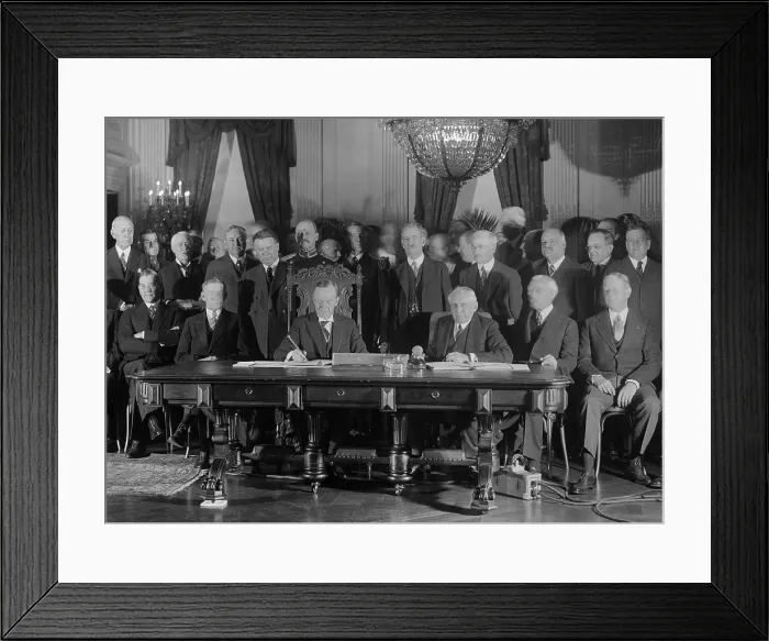 Framed Print : President Coolidge signs Kellogg Treaty in the East Room of the White House on Jan. 17, 1929. Kellogg-Briand Pact was an multi-national agreement to outlaw war