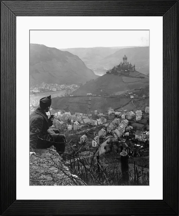Framed Print : American soldier looks toward an old castle perched on a hilltop above the Moselle River and the town of Cochem, Germany. Cochem was the U.S. Fourth Army Corps. Jan. 9, 1919