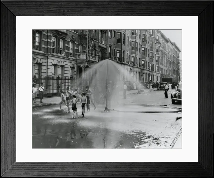 Framed Print : African American children playing in water sprayed from a sprinkler in South Harlem, NYC, Aug. 8, 1937. (BSLOC_2013_8_96)