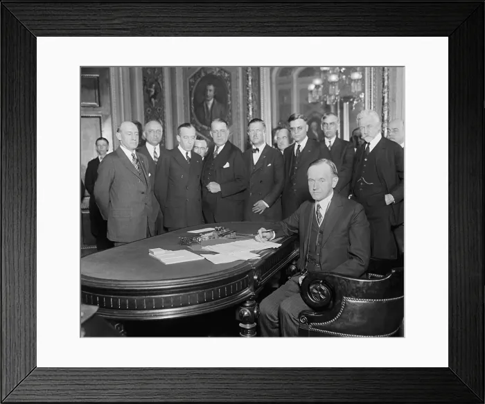 Framed Print : President Calvin Coolidge signing bills at the Capitol, June 7, 1924. At right are Sen. Smoot Reed, Sen. Henry Cabot Lodge, and Speaker of the House, Rep. Nicholas Longworth
