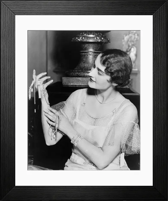 Framed Print : Model with $250, 000 worth of gems in a Chicago store. They would be worth $3.3 million in 2012 dollars. Ca. 1930. (BSLOC_2013_8_98) Framed Print : Model with $250, 000 worth of gems in a Chicago store. They would be worth $3.3 million in 2012 dollars. Ca. 1930. (BSLOC_2013_8_98)