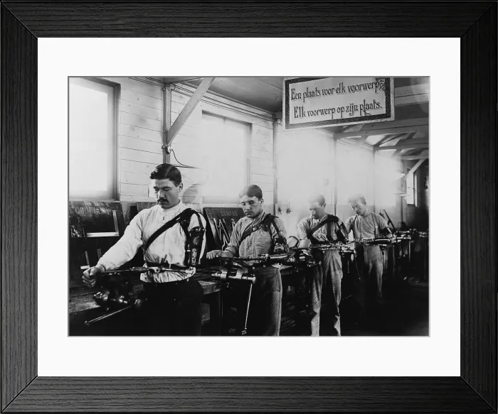 Framed Print : Four Belgian WW1 veterans with a prosthetic arms working in a machine shop in 1917. The occupational therapy took place at the Institute de Port Villez, Belgium. (BSLOC_2012_4_66)