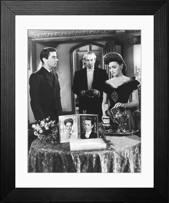 Framed Print : THE PICTURE OF DORIAN GRAY, standing from left: Peter Lawford, George Sanders, Donna Reed, in photographs from left:Donna Reed, Hurd Hatfield, 1945 Framed Print : THE PICTURE OF DORIAN GRAY, standing from left: Peter Lawford, George Sanders, Donna Reed, in photographs from left:Donna Reed, Hurd Hatfield, 1945