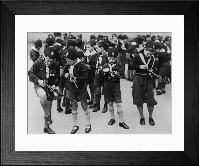 Framed Print : Boys of the Balilla, a fascist youth group, learning to load small rifles. Rome, Italy, 1930s. (BSLOC_2013_9_130)