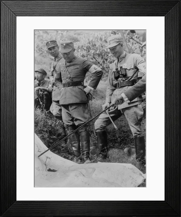 Framed Print : Generalissimo Chiang Kai-shek and other Chinese officers. They are outdoors with a map planning their next military campaign. Ca. 1937-1943. Photo by Marcus J. Clark