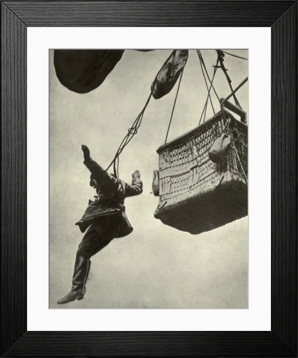 Framed Print : German WW1 observer jumping from burning balloon harnessed to a parachute. 1916-18. The parachute was attached to the basket's side so as to detach