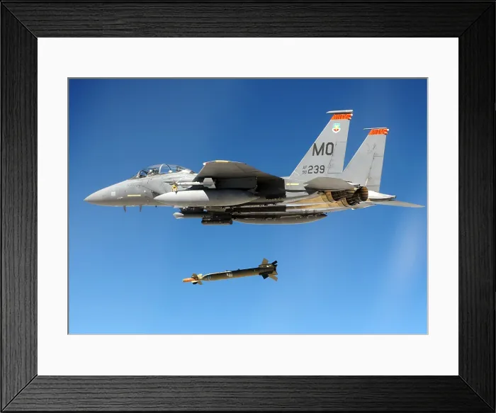 Framed Print : F-15 Strike Eagle Fighter drops a Guided Bomb during a combat exercises at Hill Air Force Base Utah. Ca. 1980s. (BSLOC_2011_12_215)