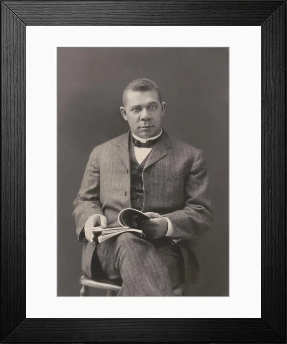 Framed Print : Booker T. Washington sits with books on his lap, c. 1903 Framed Print : Booker T. Washington sits with books on his lap, c. 1903
