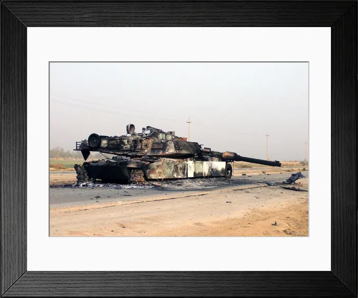 Framed Print : A scuttled Abrams Tank rests in front of a Fedayeen camp just outside of Jaman Al Juburi Iraq during the Second Gulf War Framed Print : A scuttled Abrams Tank rests in front of a Fedayeen camp just outside of Jaman Al Juburi Iraq during the Second Gulf War