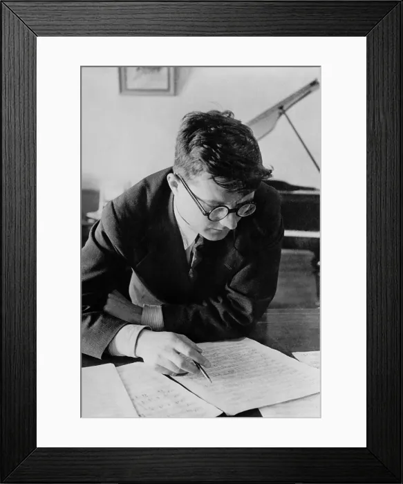 Framed Print : Dmitri Shostakovich, Russian composer, studying a piece of music, 1942-43. In Dec. 1941 he dedicated his Symphony No Framed Print : Dmitri Shostakovich, Russian composer, studying a piece of music, 1942-43. In Dec. 1941 he dedicated his Symphony No