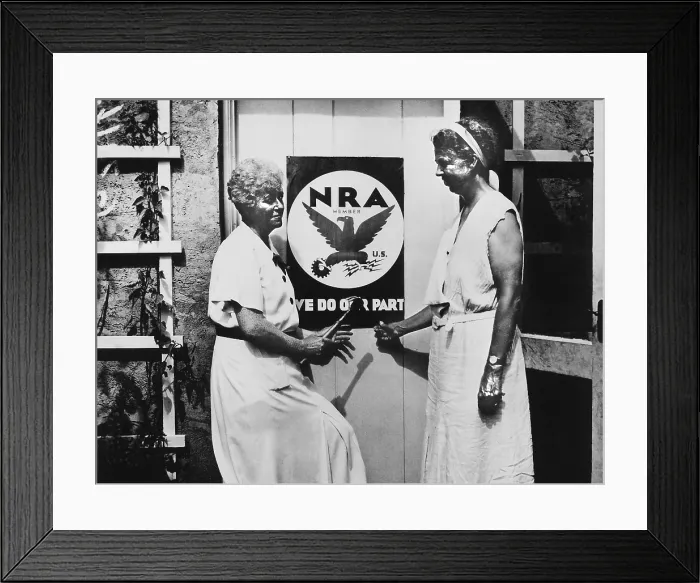 Framed Print : Eleanor Roosevelt and Nancy Cook with a NRA poster at Val-Kill in Hyde Park. 1933