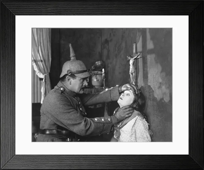 Framed Print : Still from Goldwyn's all-star Liberty Loan picture, Stake Uncle Sam to Play Your Hand. Mae Marsh, plays a Belgian girl, and A.C. Gibbons is a German soldier Framed Print : Still from Goldwyn's all-star Liberty Loan picture, Stake Uncle Sam to Play Your Hand. Mae Marsh, plays a Belgian girl, and A.C. Gibbons is a German soldier