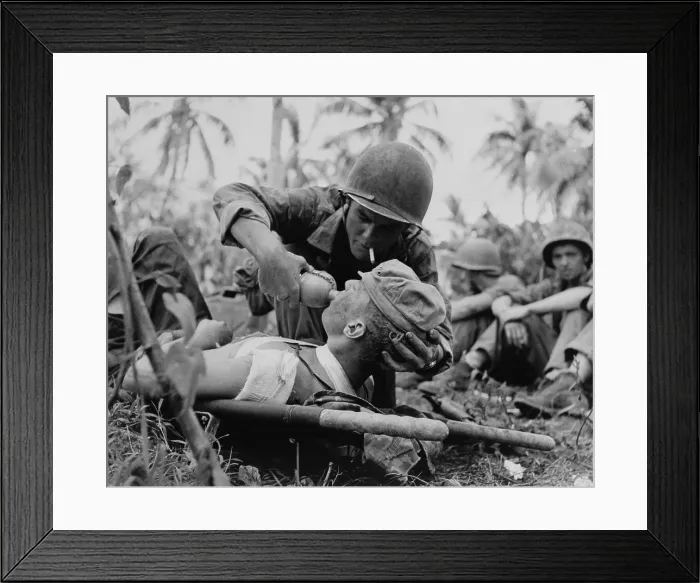 Framed Print : US Navy corpsman gives a drink to wounded Marine on Guam, July 1944, during World War 2. (BSLOC_2017_20_187)