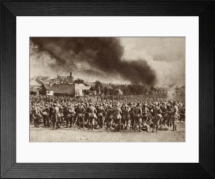 Framed Print : World War 1. German troops gathered after driving the Russians from Garlice, Galicia. The smoke is from the town that was put to the torch by the Germans. 1915