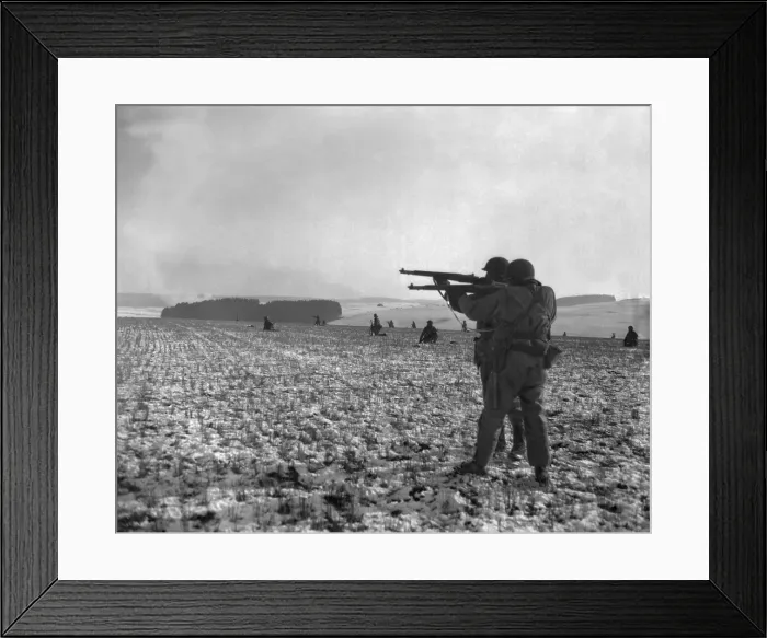 Framed Print : U.S. soldiers fire at Germans positions to relieve besieged airborne troops in Bastogne, Belgium. Dec. 27, 1944. Battle of the Bulge, World War 2. (BSLOC_2014_2_195) Framed Print : U.S. soldiers fire at Germans positions to relieve besieged airborne troops in Bastogne, Belgium. Dec. 27, 1944. Battle of the Bulge, World War 2. (BSLOC_2014_2_195)