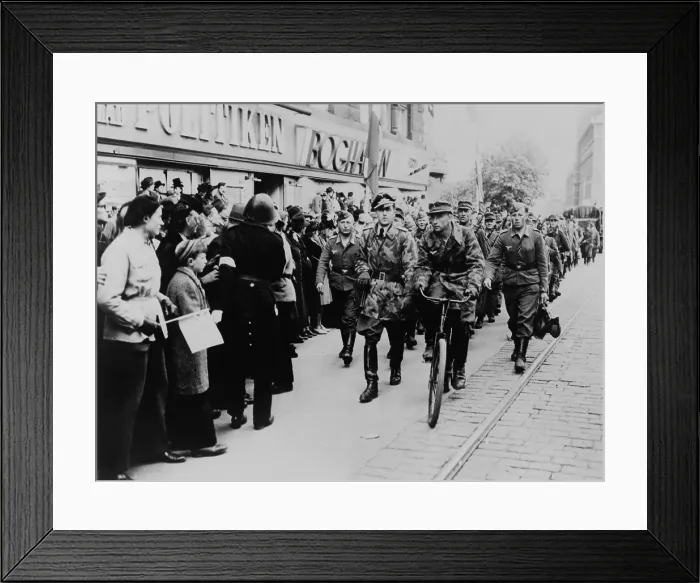 Framed Print : Nazi soldiers march down a commercial street in German-occupied Denmark in 1945