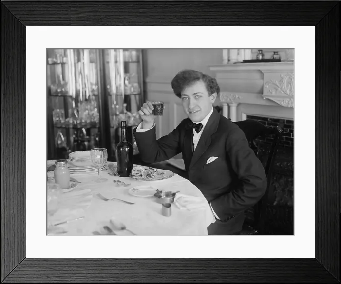 Framed Print : Jascha Heifetz, teenage Russian born violin virtuoso at meal time in New York City, c. 1917