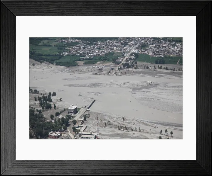 Framed Print : An aerial view of damage caused by unprecedented flooding in the Khyber Pakhtunkhwa province of Pakistan. Aug. 5 2010. (BSLOC_2011_12_381)