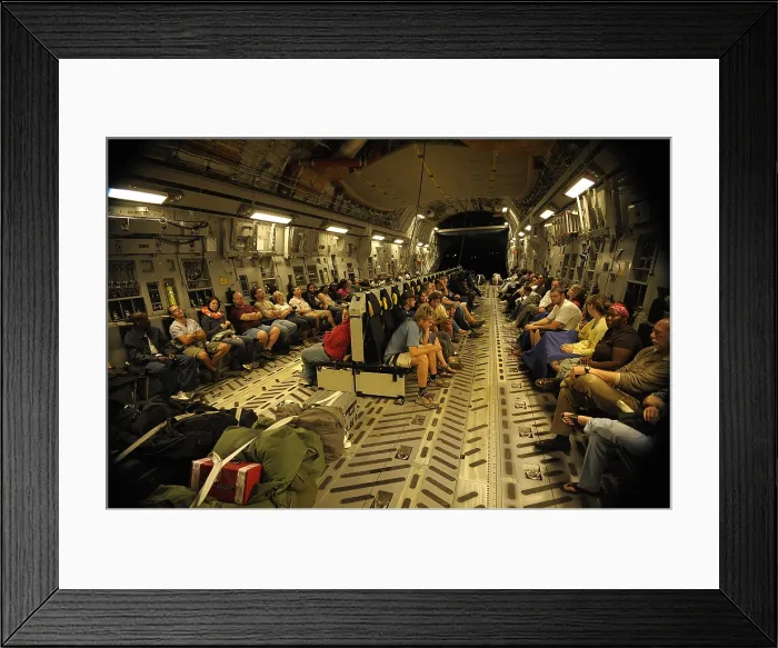 Framed Print : US citizens evacuated from earthquake stricken Haiti in a Air Force C-17 transport. Jan. 15 2010. (BSLOC_2011_12_384)